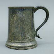 A 19th century silver-plated tankard. 13 cm high.