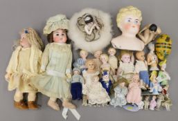 A collection of various Victorian and later small dolls and half dolls etc. The largest 24 cm high.