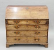 A George III mahogany bureau. 106 cm wide.