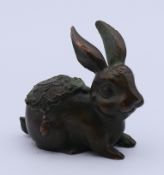 A bronze model of a rabbit/hare. 4 cm high.