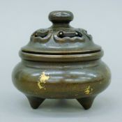 A Chinese gold splash bronze censer. 9 cm high.