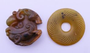 Two jade roundels. Goat roundel 4.5 cm diameter.