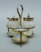 A silver cruet stand of tripartite form. 8.5 cm high. 44.5 grammes.