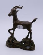 A bronze model of a deer. 11.5 cm high.