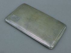 A silver cigarette case. 14.5 cm long. 203 grammes.