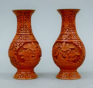 A pair of Chinese cinnabar vases. Each 15 cm high.