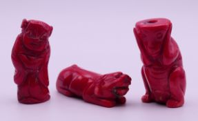 Three coral carvings. Two 5.5 cm high.