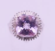 A 9 K white gold kunzite ring. Ring size M. 4.3 grammes total weight.