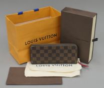A Louis Vuitton Damier Azur Clemence purse, in dust bag and original box. The former 20 cm wide.