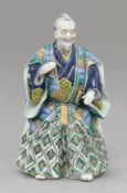 A Japanese Kutani porcelain figure of a samurai. 31 cm high.