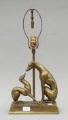 An early 20th century bronzed table lamp surmounted with greyhounds. 57 cm high.