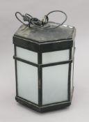 A black-painted brass-framed hanging lantern. 50 cm high.