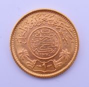 A Saudi 22 ct gold Guinea coin. 8 grammes.