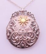 A silver pendant locket inscribed to reverse 'However much you love me,