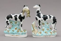 A pair of 19th century Staffordshire pottery Disraeli coursing greyhounds. The larger 28 cm high.