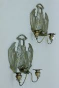 A pair of bronze bat-form wall sconces. Each 24 cm wide.