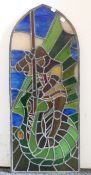 A stained glass panel depicting St George and the Dragon, made in 1994. 92 x 38 cm.