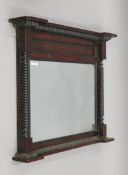 A Victorian mahogany over mantle mirror. 106.5 cm wide and 82 cm high.