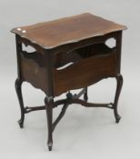 An Edwardian mahogany drop-flap table. 63 cm wide.