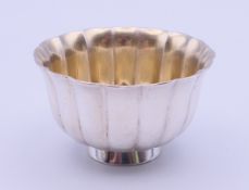A Bulgari fluted sterling silver caviar bowl, engraved Bulgari, London, 1988 to underside.