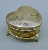 A silver heart-shaped trinket box. 5.5 cm wide. 30.14 grammes total weight.
