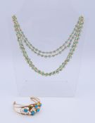 A turquoise and 1/20 14 K gold necklace and a 1/20 12 K gold and turquoise bracelet.