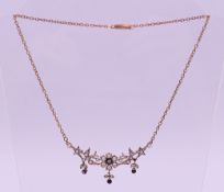 A Victorian silver gilt, seed pearl and amethyst necklace. 44 cm long.