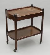 A mid-20th century tea trolley. 67 cm long.