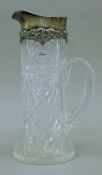 A sterling silver-mounted cut glass jug. 31 cm high.