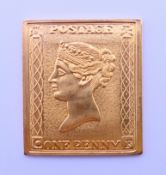 A 900 gold commemorative Penny Black stamp. 2 cm wide. 7 grammes.