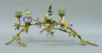 A gilt metal candelabra mounted with porcelain birds. 55 cm long.
