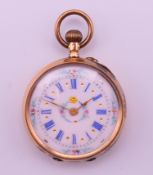 An unmarked gold cased ladies fob watch, the white enamel dial with floral decoration,