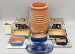 A chimney pot, two hanging garden lanterns,