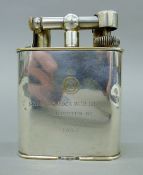 A vintage circa 1950's silver-plated Dunhill Giant table lighter with presentation inscriptions. 10.
