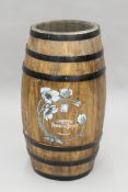 A wooden barrel-form stick stand. 60 cm high.