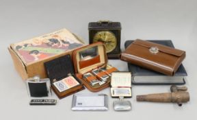A quantity of miscellaneous items, including a vintage photograph album, a Ronson lighter, games,