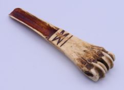 An 18th/19th century carved bone apple corer. 11.7 cm high.