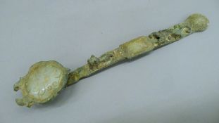 A Chinese jade-mounted bronze ruyi sceptre. 30.5 cm long.
