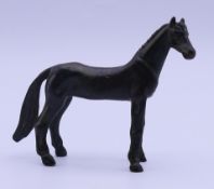 A small bronze model of a horse. 7 cm high.