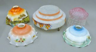 A quantity of early 20th century glass light shades and a plafonnier. 32 cm diameter.