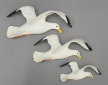 A set three Beswick flying seagull wall plaques. The largest 34 cm long.