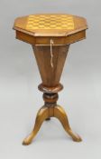 A Victorian chessboard inlaid walnut trumpet work table. 75 cm high.