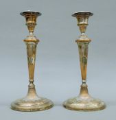 A pair of Sheffield plate candlesticks. Each 29 cm high.