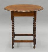 An early 20th century oak barley twist side table. 65 cm long.