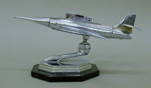 A vintage 1950's Gala Sonic chrome jet plane table lighter,