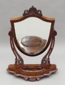 A Victorian mahogany toilet mirror. 84 cm high.