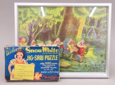 A framed Walt Disney's Snow White and the Seven Dwarfs jigsaw puzzle with original box. 29 x 36.
