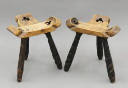 A pair of Continental carved wooden stools. Each 39 cm wide.