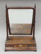 A George III mahogany toilet mirror. 44 cm wide.