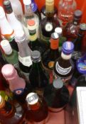 A quantity of bottles of various alcohol, including Lamb's Navy Rum, Smirnoff vodka, Bacardi,